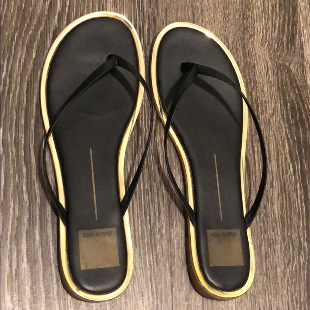 Black and gold flip flops